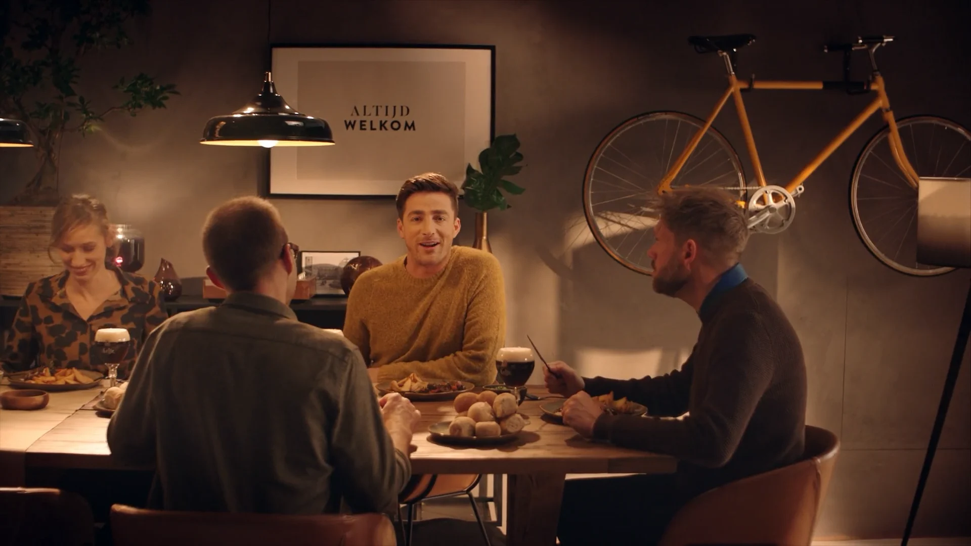 Friends sharing the meal around the table