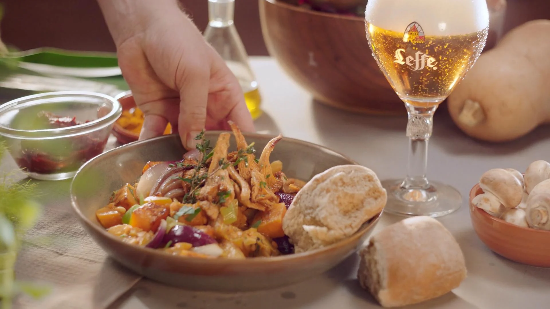 The finished dish being served at the table