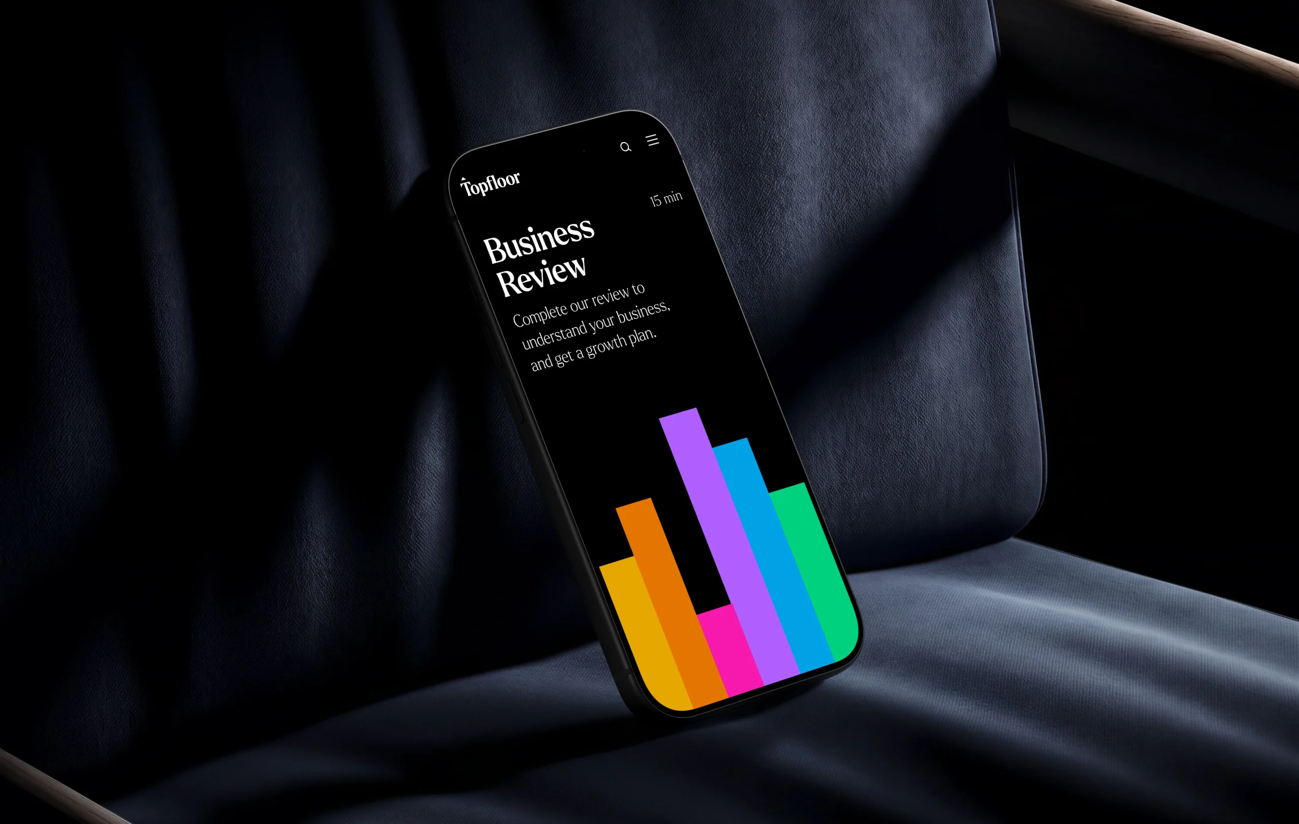 The Business Review on a phone, with the brand colour spectrum