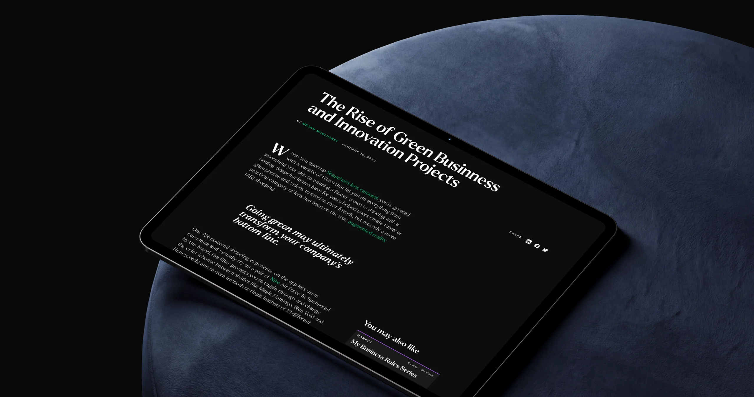 An editorial article on a tablet — The Rise of Green Business